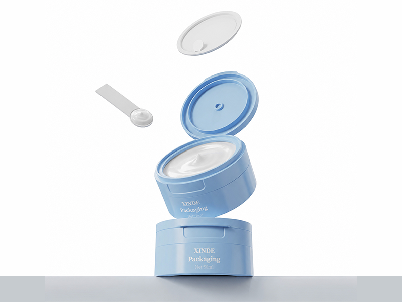 Light blue flip-top cap plastic cosmetic jar with built-in spoon, customizable empty skincare cream packaging pot