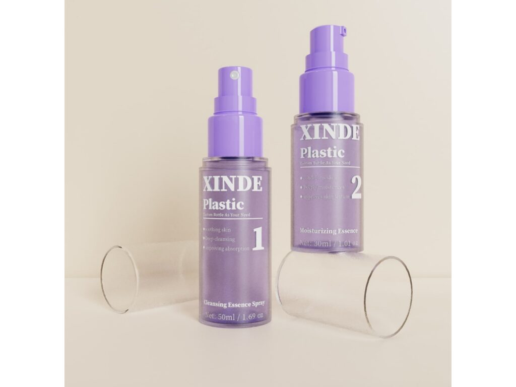 XD-195 frosted translucent purple mist bottles, 30ml and 50ml with purple pump and clear cover for skincare spray packaging