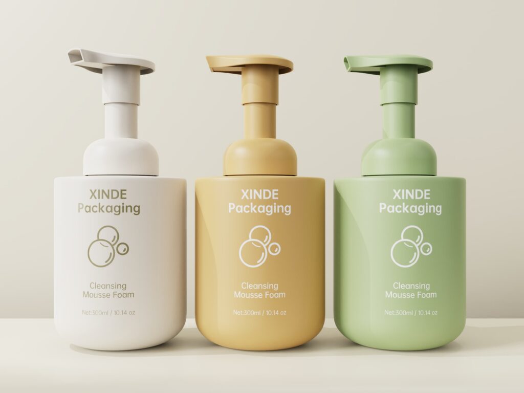 Three round cleansing mousse foam pump bottles in white, yellow, and green, 300ml PET cosmetic packaging for facial cleansers