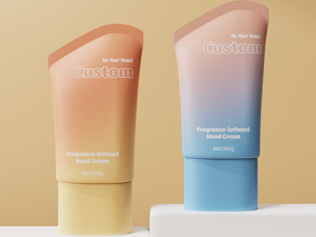 Two custom 60g cosmetic hand cream tubes with slanted seal top, in orange-yellow and blue-pink gradient finishes