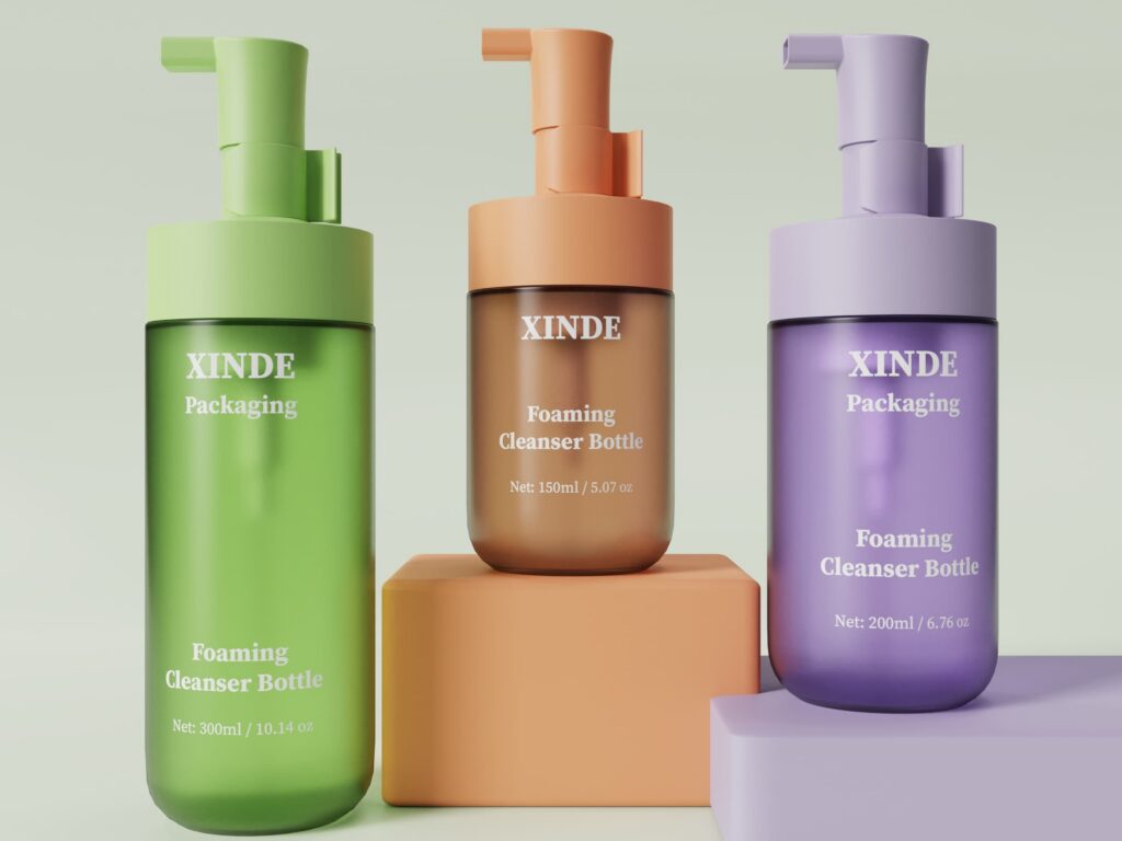 Three foaming cleanser PET bottles with matching pumps in green, amber, and purple, 300ml, 150ml, and 200ml